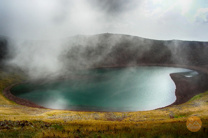 Fog over the lake in the crater of Azhdahak mountain in Armenia