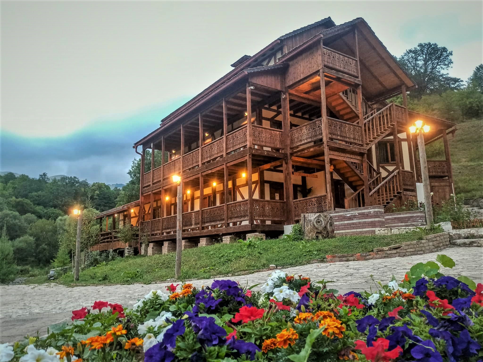 Ecokayan Dilijan Resort Hotel Main Building. Entrance with flowers